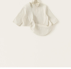 Detailed flat lay of a girls' striped zip-up jacket and matching crossbody bag set