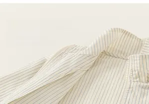 Close-up of the light blue pinstripe jacket collar with white zipper and soft cotton fabric