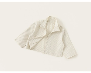 Detailed macro view of children striped zip-up shirt with collar and white zipper detail