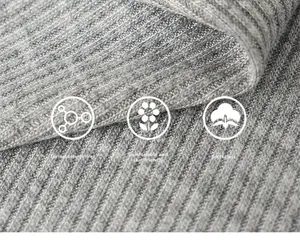 Close-up of grey ribbed knit fabric showing soft, eco-friendly, and skin-friendly texture