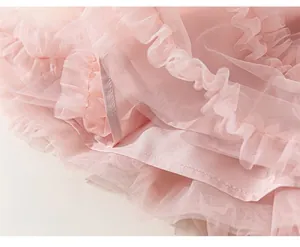 Detailed macro view of pink multi-layer mesh fabric and ruffles on the cake skirt