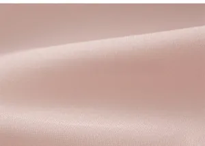 Close-up of soft pink mesh fabric showing smooth texture and detailed diagonal weave