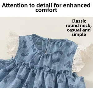 Close-up of blue dress neckline with bow print and delicate white lace trim details