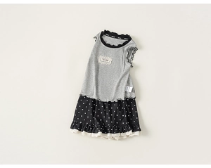 Detail of ruffle trim neckline and heart print hem on a girl's two-piece casual set