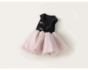 Detail of contrast bow decoration and ribbed cotton texture on the sleeveless pet tutu dress