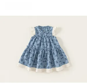 Close-up of girls blue bow print dress with white lace flutter sleeves and tiered hem