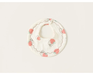 Close-up of baby petal bib featuring soft cotton gauze and fresh strawberry pattern print