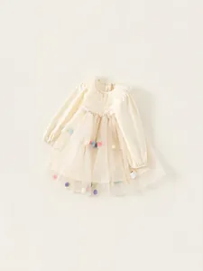 Robe longue manche crème pour fille avec jupe en tulle ornée de pompons colorés