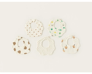 Flat lay of five petal-shaped cotton gauze baby bibs with cute cartoon patterns
