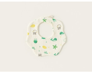 Close-up of petal-shaped cotton baby bib with colorful sea creature prints and snap button