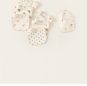 Detailed view of soft cotton muslin baby bibs with cute bear and floral animal prints