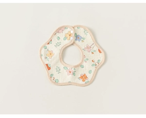 Macro view of floral baby bib featuring pink flowers and strawberry patterns with snap buttons