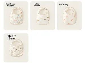Macro view of four baby bib patterns including strawberry, lemon, rabbit and bear designs