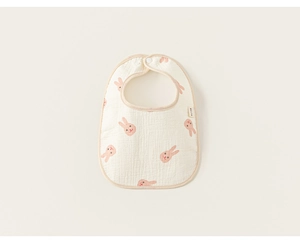 Detail of baby cotton gauze bib featuring cartoon rabbit print and soft texture