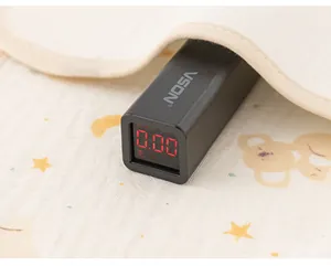 Fluorescence testing device showing zero value on a cotton fabric texture