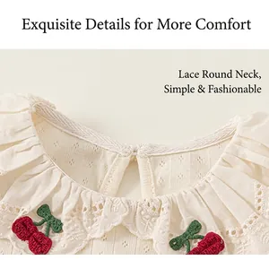 Detailed view of kids cotton t-shirt featuring lace round neck and cherry embroidery