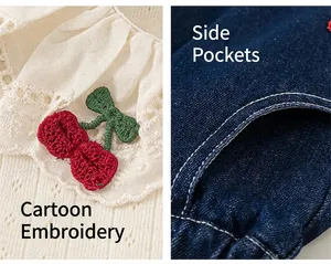 Detail of lace collar with cherry embroidery and functional pockets on denim shorts