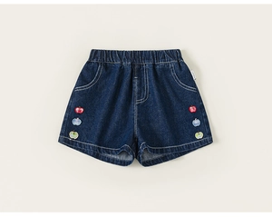 Detailed close-up of dark denim kids shorts with cute apple embroidery and elastic waist