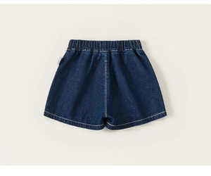 Detailed view of dark blue children's denim shorts with elastic waist and white stitching