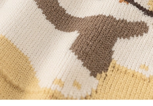 Dettaglio del gilet in maglia per bambini con trama jacquard e blocchi di colore geometrici