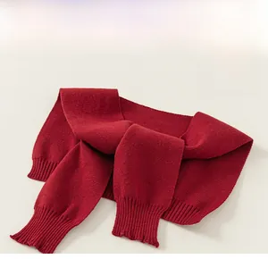 Detailed close-up of dark red knitted shawl showing fine ribbed texture and premium stitching
