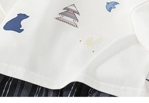 Close-up of cotton baby outfit showing fine fabric texture and neat stitching on hem