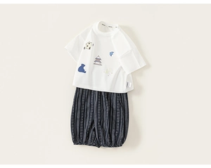 Detail of baby summer set showing cotton t-shirt with cute bear embroidery and striped shorts
