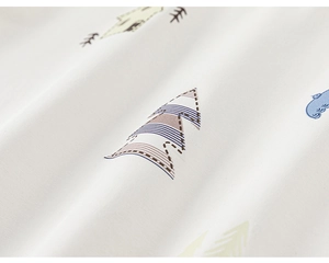 Close-up of soft cotton fabric texture featuring Nordic minimalist tree print design