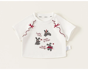Close-up of off-white kids' t-shirt with red bow and cute bunny prints detail