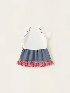 Girls summer outfit with bow short sleeve top and plaid patchwork denim skirt