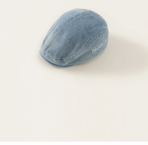 Close-up of light blue denim beret for kids with white cursive embroidery Ohaier