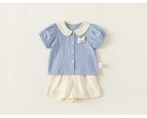 Detail of girls' plaid doll collar shirt with cat patch and solid summer shorts