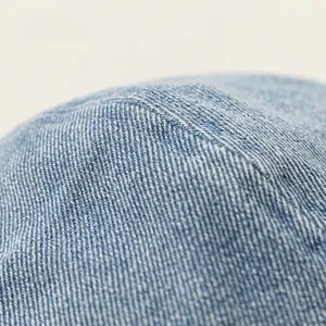 Light blue denim beret cap for kids featuring vintage twill texture and detailed stitching