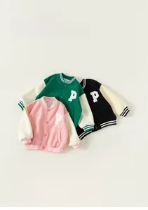 Flat lay of colorful kids varsity jackets with letter P patches and striped ribbing