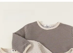 Close-up of striped long sleeve cotton shirts with high quality neck binding detail