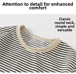 Detailed close-up of classic round neck and fine striped fabric of children's long sleeve tee