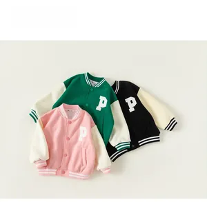 Detailed flat lay of children baseball jackets in pink, green, and black colors