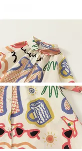 Détail d'une chemise en coton pour enfant avec graffiti coloré et col boutonné