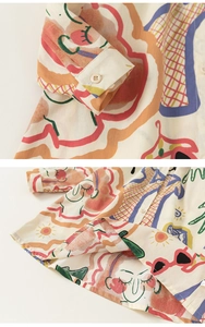 Vue détaillée de la blouse en coton et lin avec des motifs artistiques colorés faits main