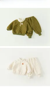 Close-up of diamond quilted kids thermal set with stand collar and zipper detail