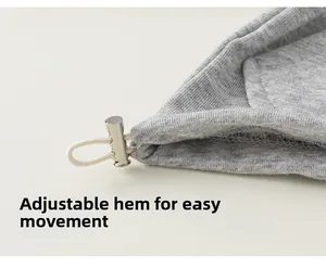 Close-up detail of gray knit cardigan featuring adjustable white drawstring hem with silver buckle
