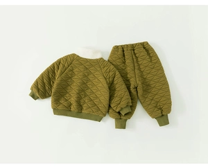Detail of army green quilted winter suit for kids with white faux fur collar and ribbed cuffs