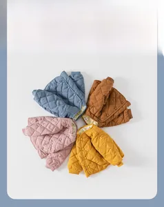 Detailed view of quilted baby jackets in four candy colors with diamond patterns
