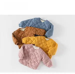 Detailed view of quilted cotton jackets for toddlers in blue, brown, yellow, and pink colors
