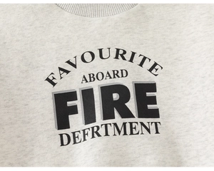 Close-up of light grey fleece sweatshirt neckline with vintage varsity lettering print