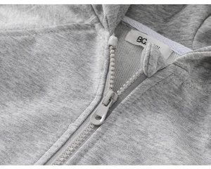 Macro detail of kids gray zip-up hoodie featuring cotton texture and size 152 label