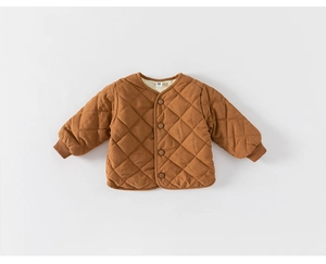 Detail of warm brown quilted winter jacket for kids with diamond patterns and buttons