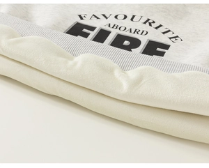 Close-up of winter fleece lining and letter print on grey kids' sweatshirt fabric