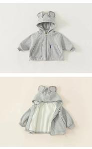 Detail of grey hooded baby jacket with bear ears and soft fleece lining and zipper