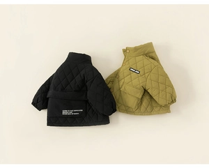 Flat lay of diamond quilted kids jackets in black and mustard green colors